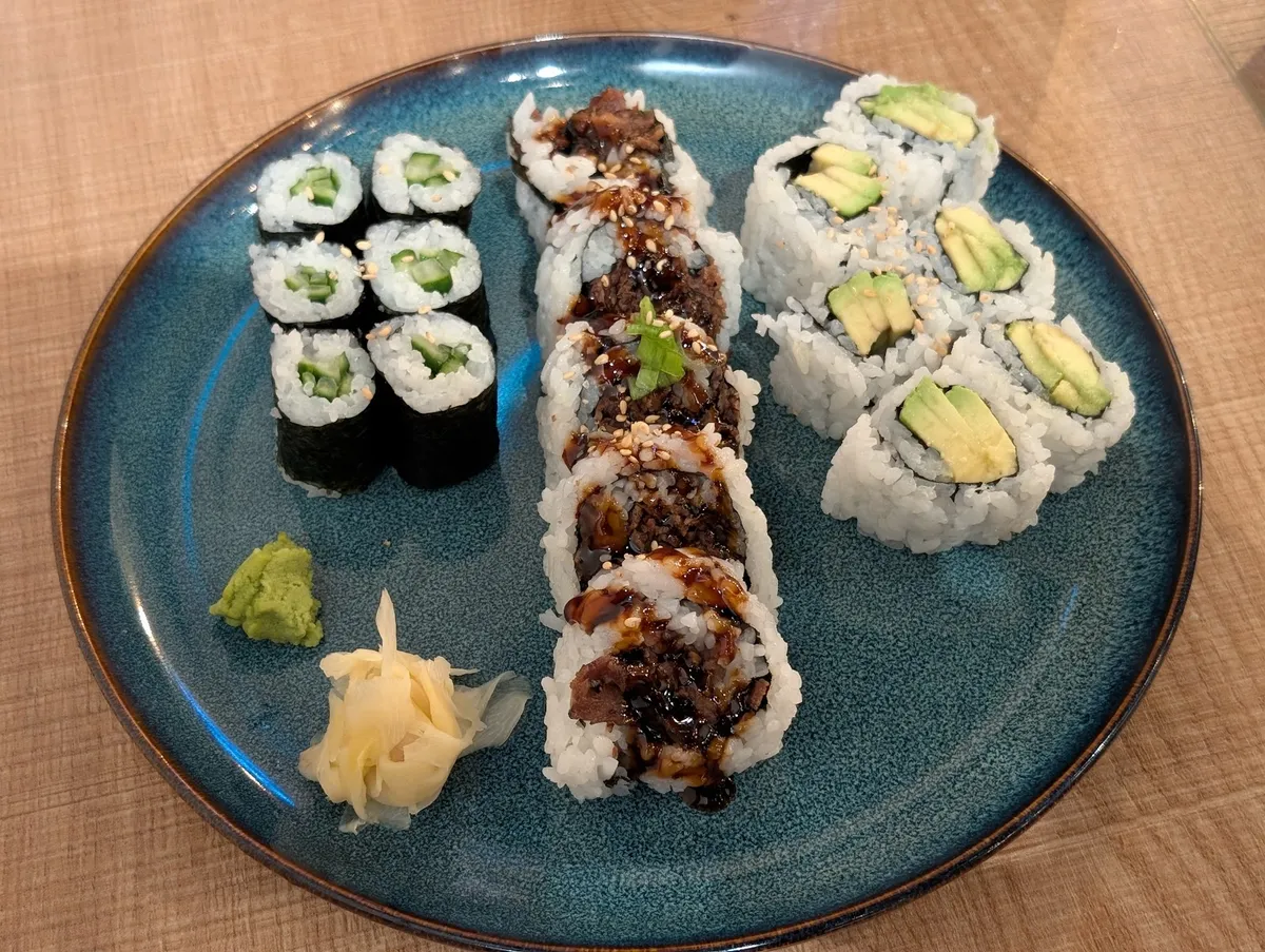 Assortment of sushi rolls with wasabi and ginger